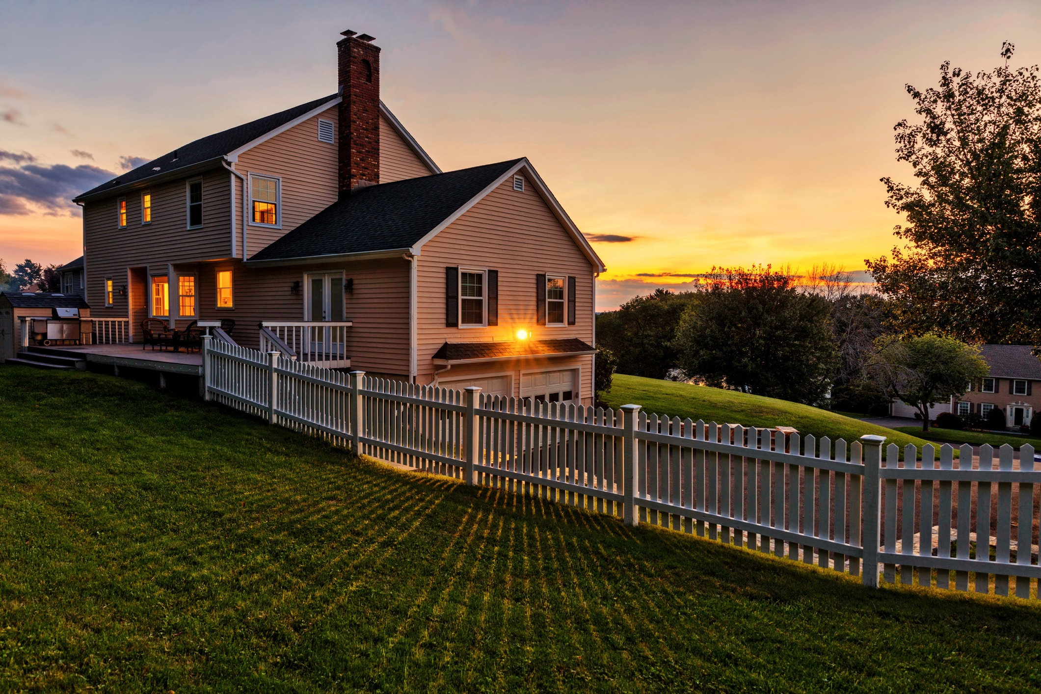 About Us 1 Beautiful colonial American house at sunset